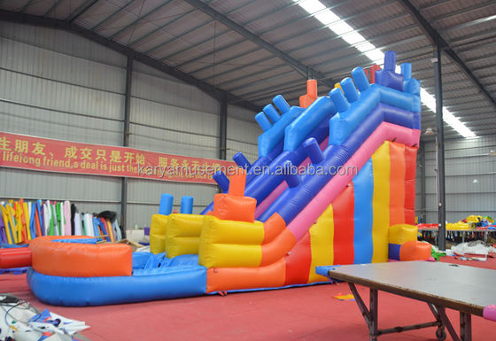2023 Op maat gemaakte luchtopblaasbare toestellen voor buiten PVC kleurrijke bouwstenen Air Jumping Slide