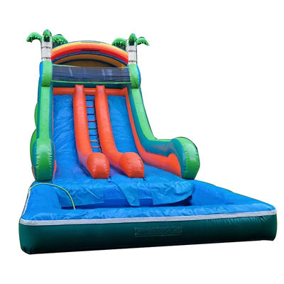 Commerciële opblaasbare waterslide met dubbele baan en tropisch palmboomthema