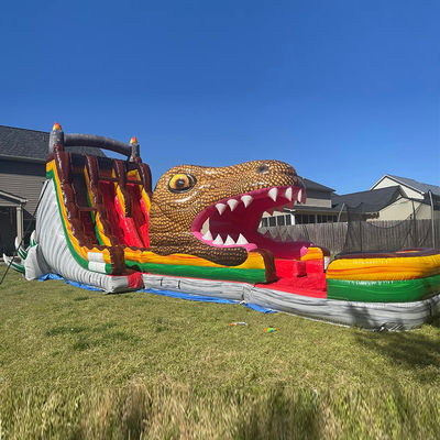 Op maat gemaakte PVC opblaasbare springglijbaan Jurassic Dinosaurus thema Waterglijbaan met zwembad