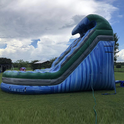 Buitenwaterpark Groot golfvormig opblaasbaar droog glijbaan met dubbele glijbanen in blauw PVC