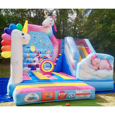 Commerciële PVC Kids Trampoline Games Regenboog Eenhoorn Opblaasbare Leuke Stad Met Glijbaan