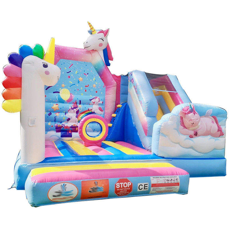 Commerciële PVC Kids Trampoline Games Regenboog Eenhoorn Opblaasbare Leuke Stad Met Glijbaan